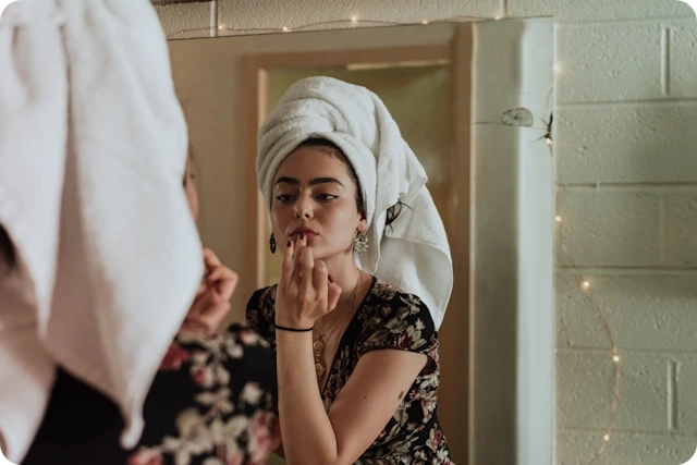 Woman cleansing her face with a gentle cleanser