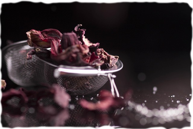 A close-up of a strainer with dried hibiscus