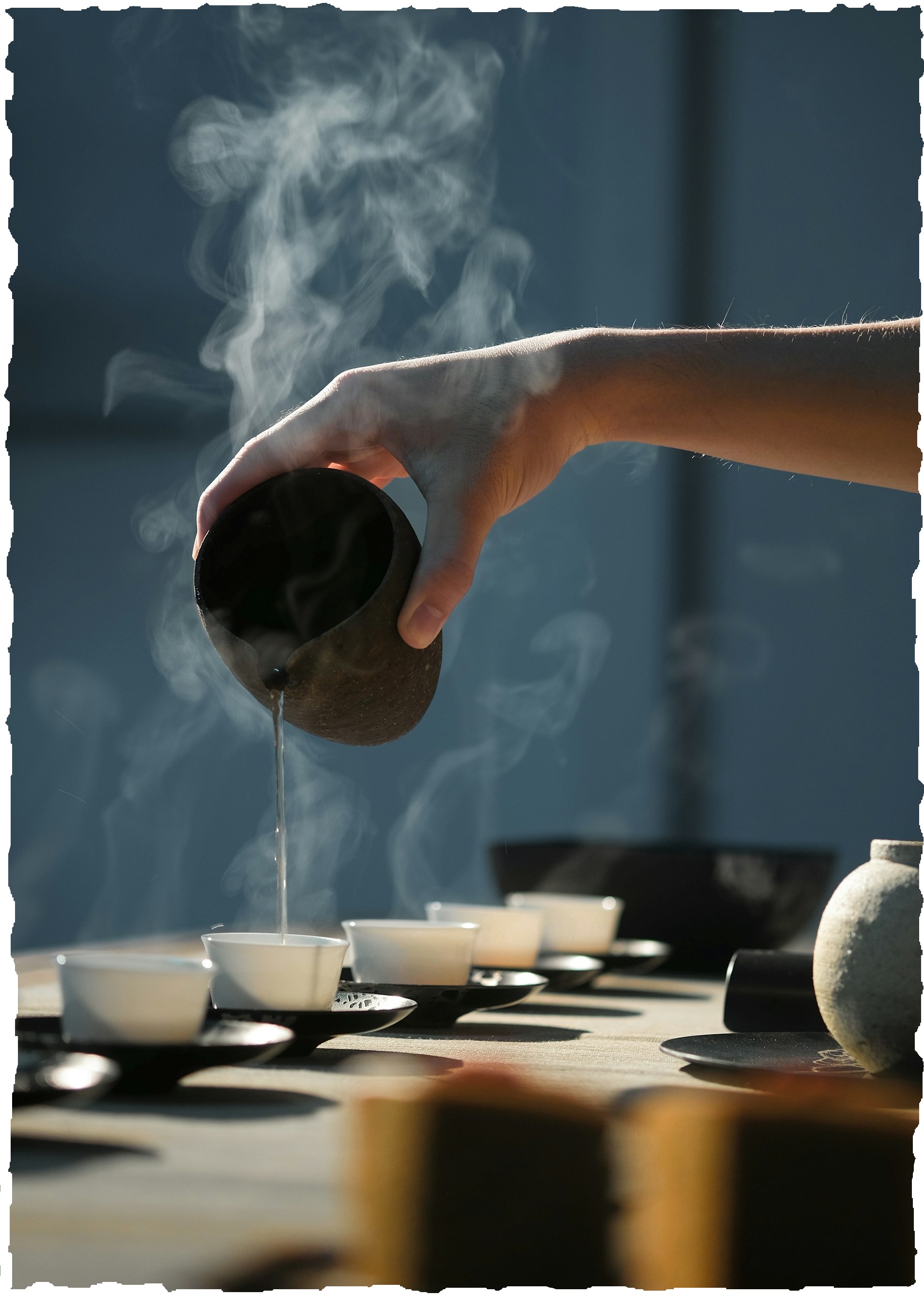 filling cups with tea