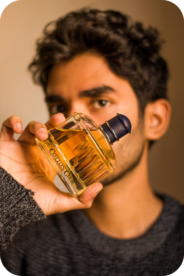 a man showing his parfume