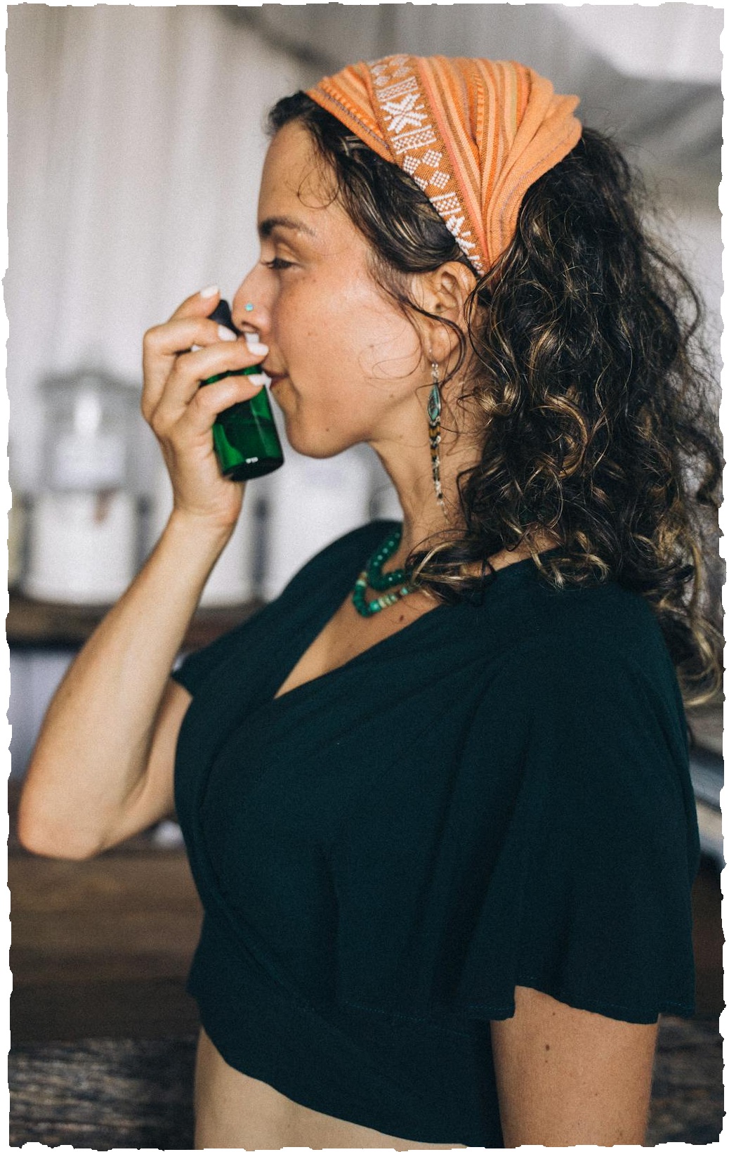 a woman smelling essential oil